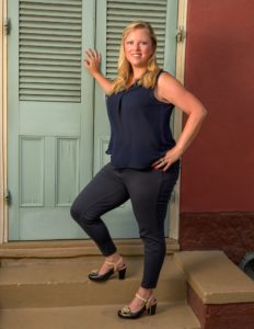 Picture of Sonja standing in front of an exterior door